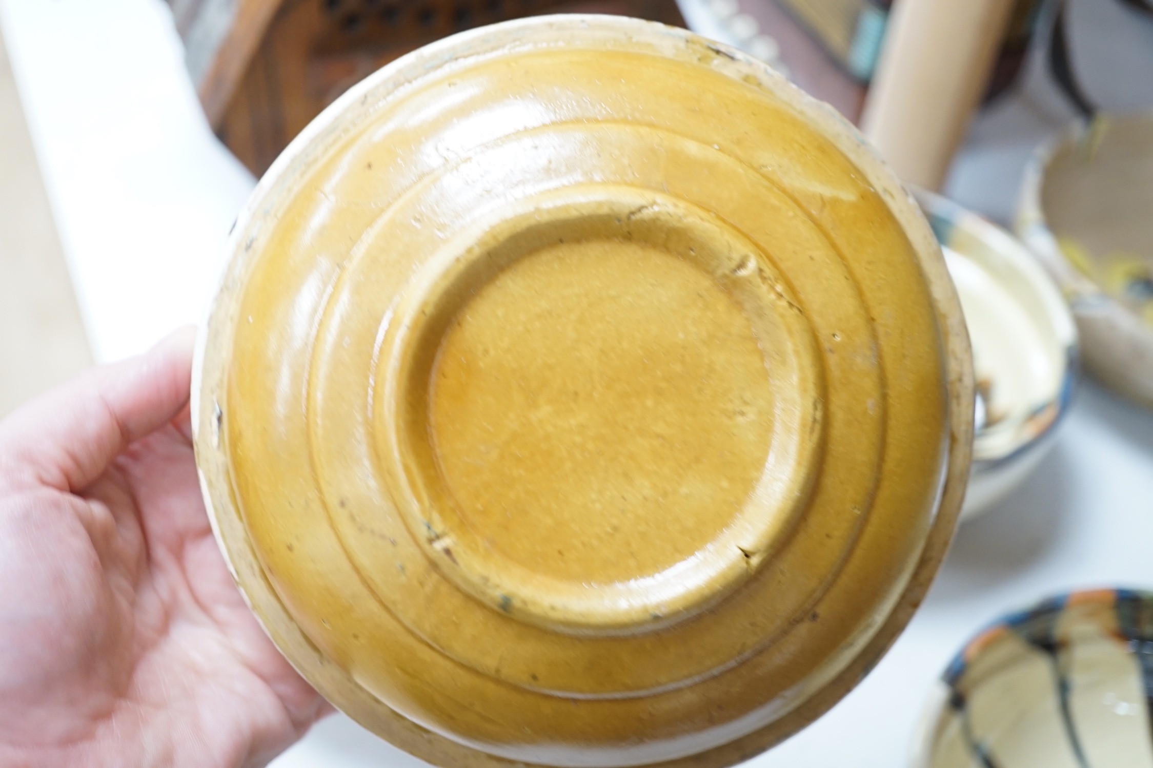 A set of six French provincial pottery bowls and a similar jug